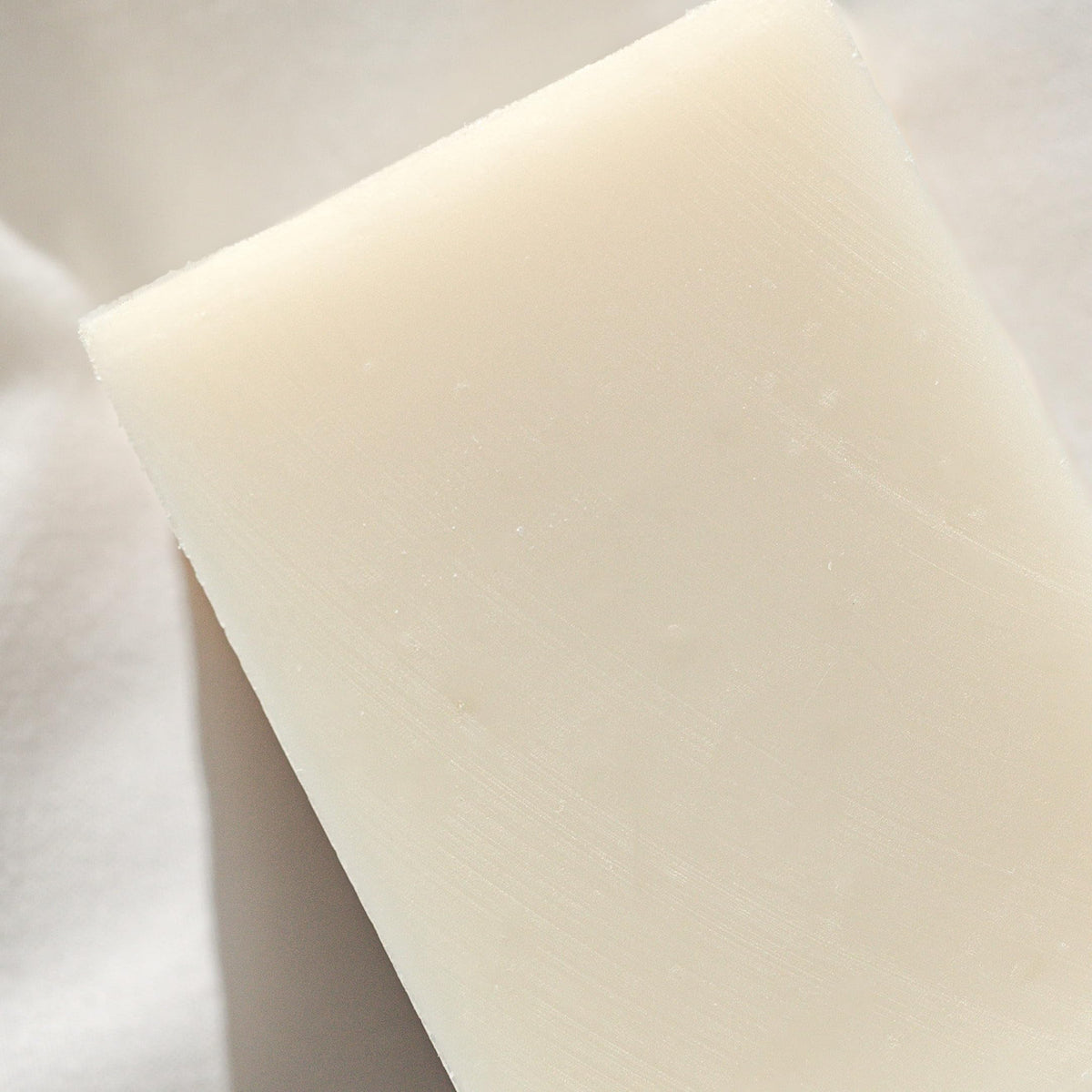 Olive oil and coconut milk highlight ingredients in Osmia Naked Body Soap.