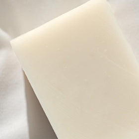 Olive oil and coconut milk highlight ingredients in Osmia Naked Body Soap.