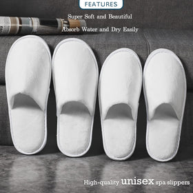 OSTADARRA spa slippers in a hotel room setup