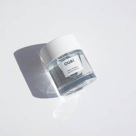 OUAI Dean Street EDP on wrists and behind knees for full-body scent