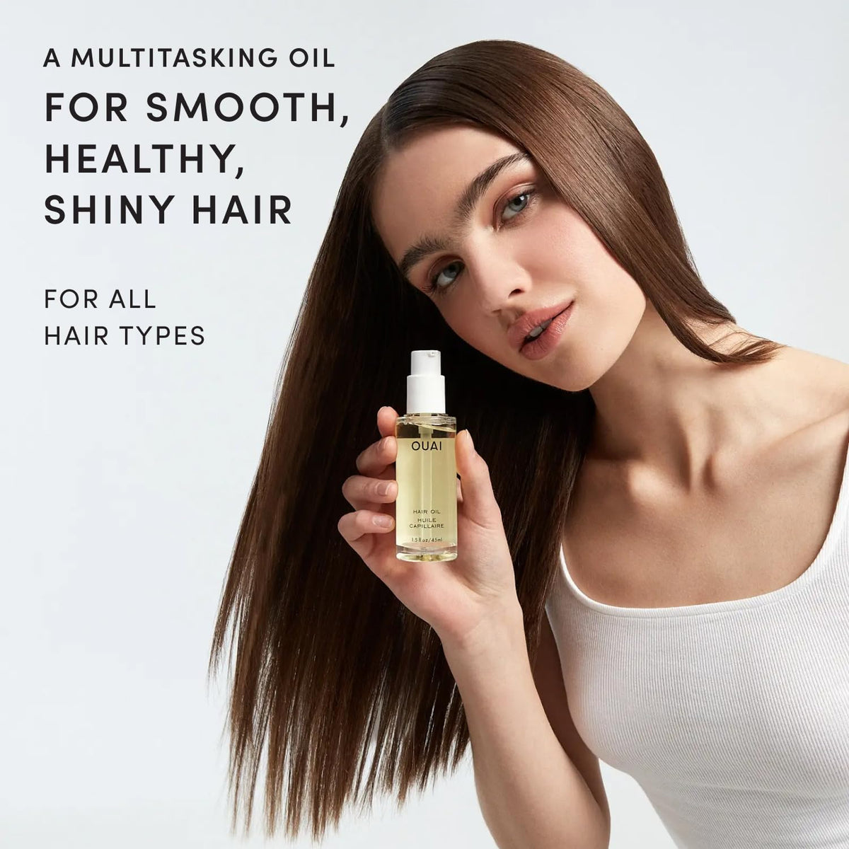 OUAI travel mini bottle ideal for on-the-go styling and frizz control.