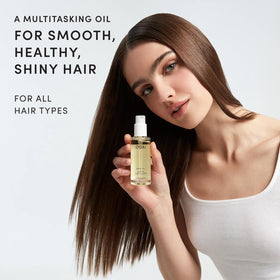 OUAI travel mini bottle ideal for on-the-go styling and frizz control.