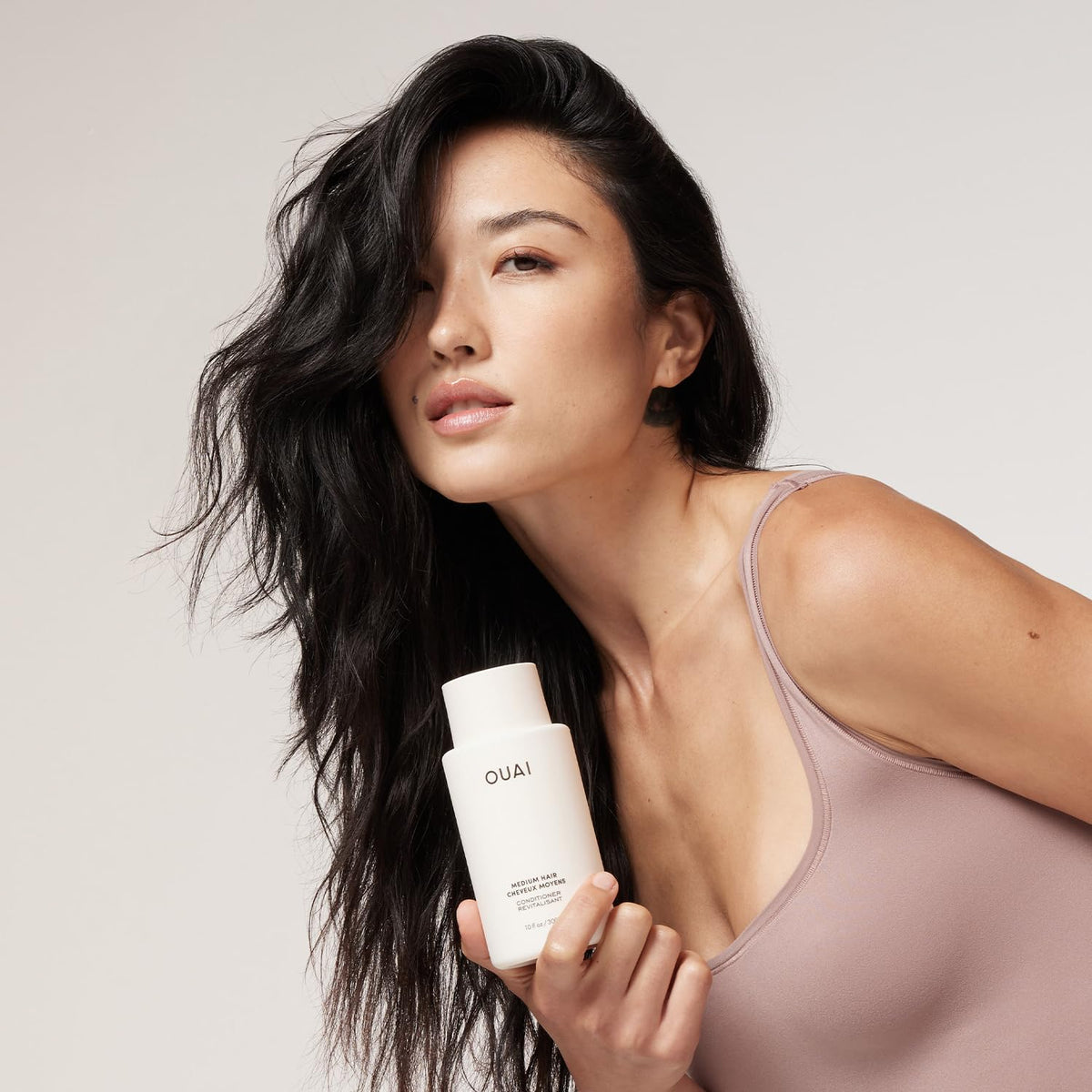 OUAI keratin frizz-control close-up showing smooth finish