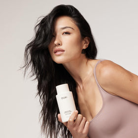 OUAI keratin frizz-control close-up showing smooth finish