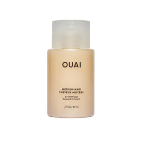 OUAI Medium Hair Shampoo travel-size bottle offers on-the-go hydration and color protection.