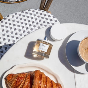 OUAI Rue St. Honore spray action for a subtle, long-lasting scent.