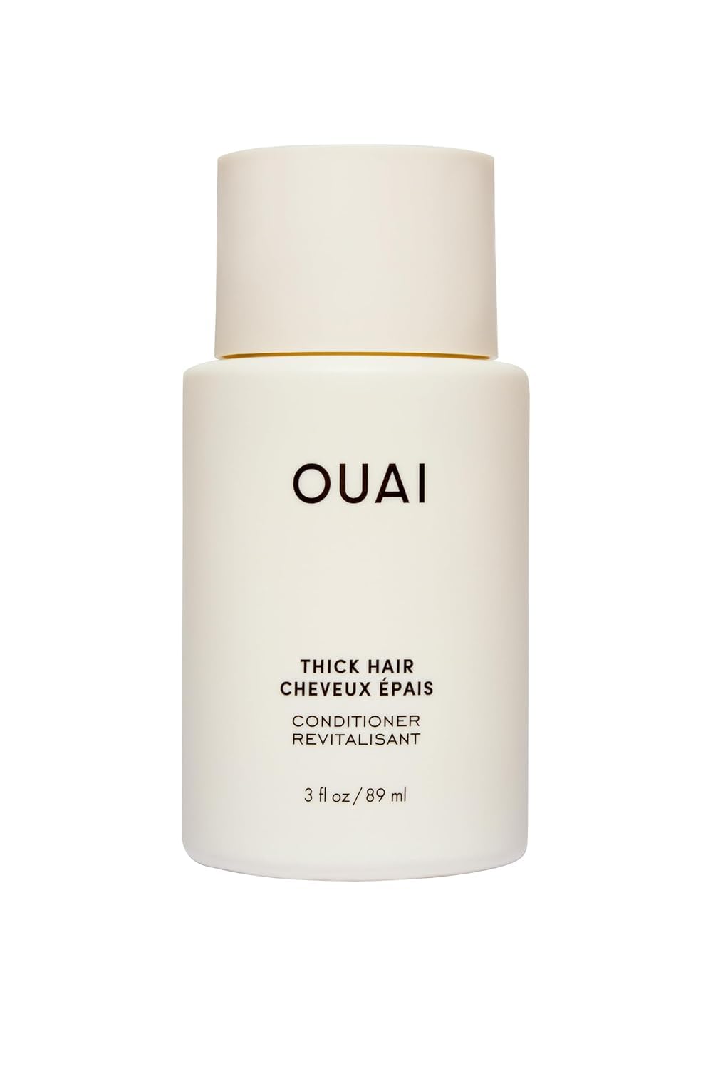 OUAI Thick Hair Conditioner travel size bottle pour for detangling and frizz control.