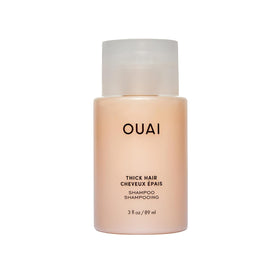 OUAI Thick Hair Shampoo travel-size bottle for moisture and frizz control