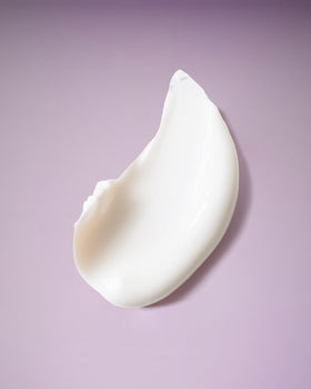 Ouidad Coil Infusion conditioner creamy texture highlighting hydration for curls