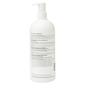 Ouidad Curl Quencher closeup reveals defined curls on damp hair