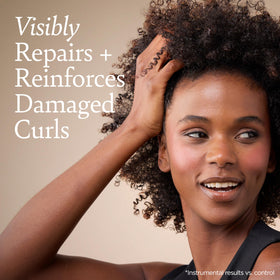 Ouidad Curl Therapy Mask on wet curls for easy detangling