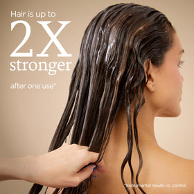 Ouidad Curl Therapy Mask label highlights keratin and ceramides for moisture balance