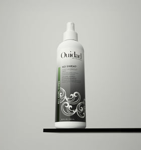 Ouidad No Sweat Post-Workout Mist closeup shows quick misting on curls.