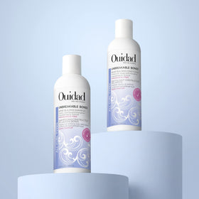 Ouidad Unbreakable Bonds Shampoo fragrance-free badge signals scalp-friendly cleansing.