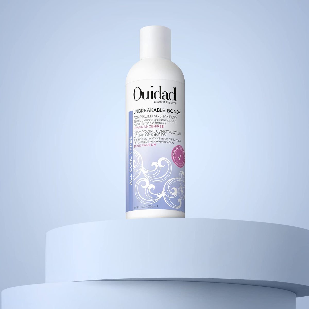 Ouidad Unbreakable Bonds Shampoo packaging hero shot emphasizing vegan collagen and moisture features.