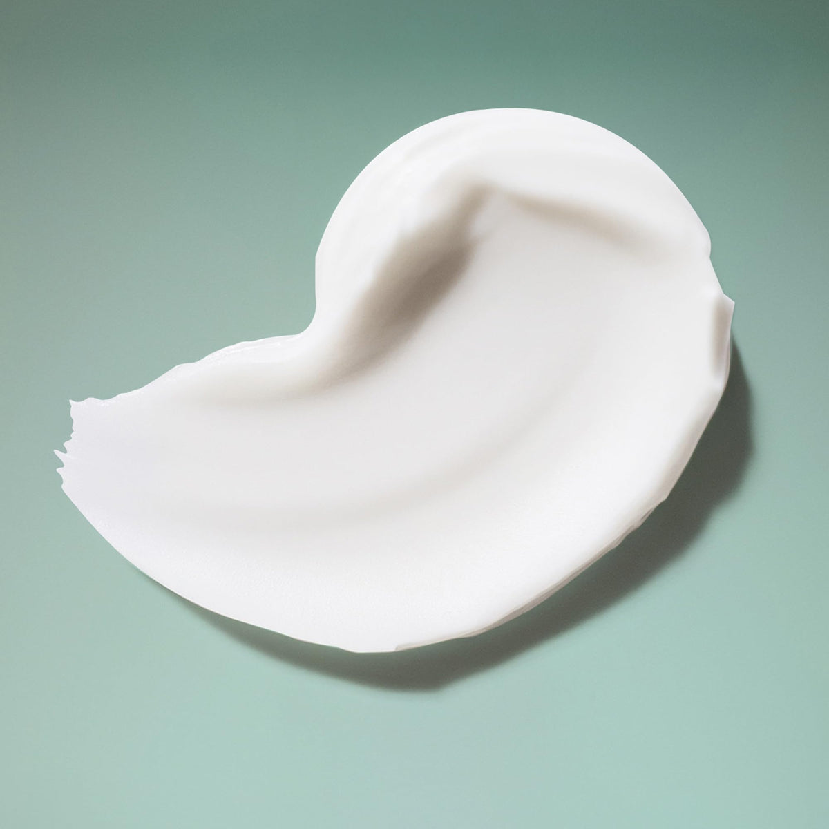 Close-up of Ouidad label highlighting vegan and silicone-free formula