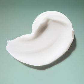 Close-up of Ouidad label highlighting vegan and silicone-free formula