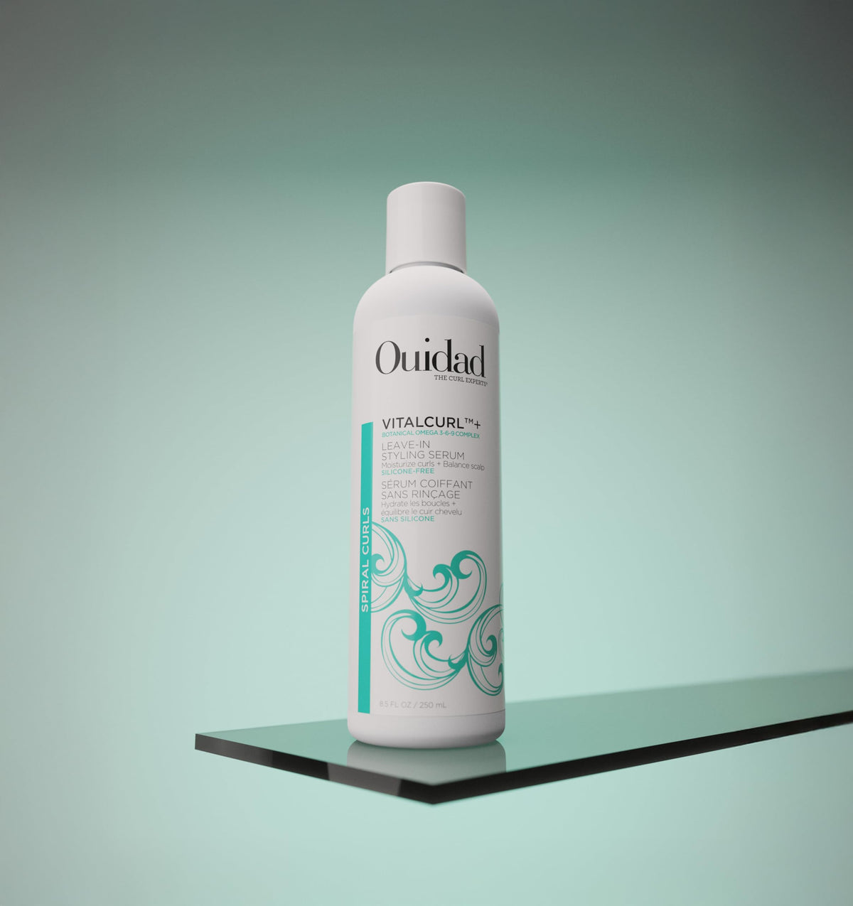 Ouidad VitalCurl Leave-In Serum on hair showing defined curls and shine
