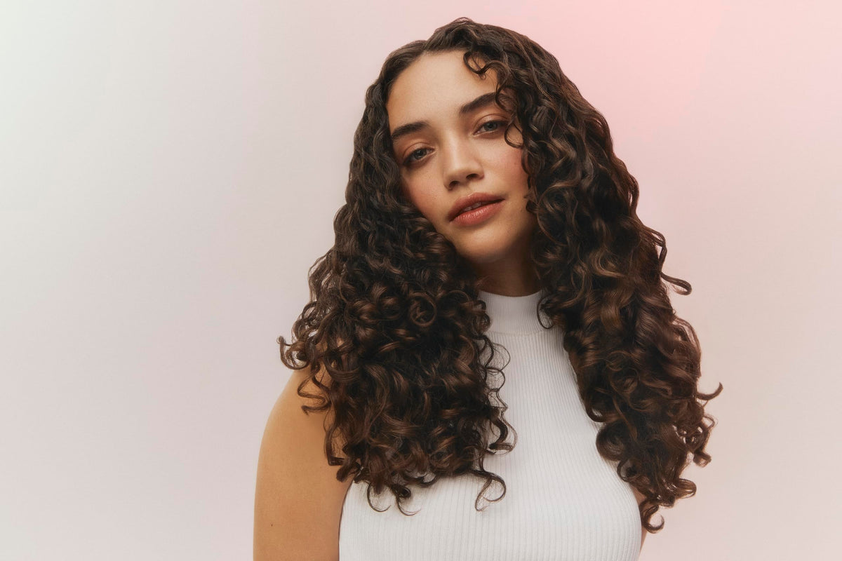 Ouidad VitalCurl Leave-In Serum applied to scalp for moisture balance