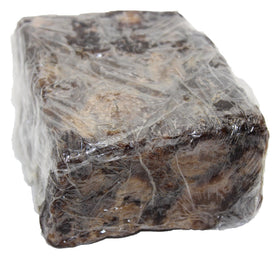 Our Earth's Secrets black soap packaging, ideal for travel and daily use