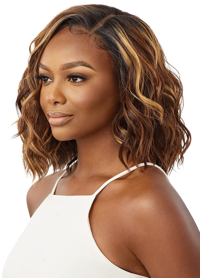 Nyla Sleeklay Part wig shade DRST2/Chocolate Caramel under warm lighting