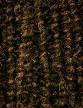 Outre PERUVIAN Batik Half Wig back view with secure placement.