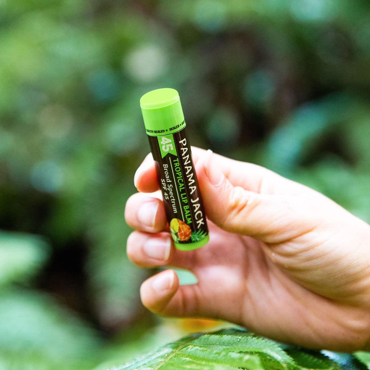 Panama Jack lip balm application close-up, smooth texture on lips.