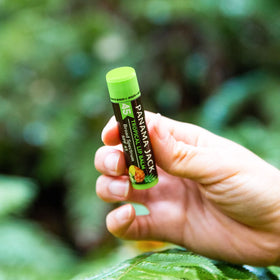 Panama Jack lip balm application close-up, smooth texture on lips.