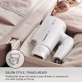 Foldable travel dryer fits in suitcase and bag for easy packing.