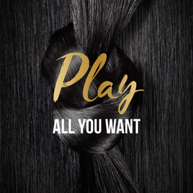 Hair before styling with spray in hand, mitigating heat exposure.