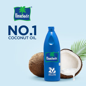 Parachute coconut oil pouring for sautéing and hair conditioning