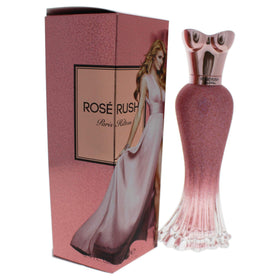 Paris Hilton Rose Rush perfume on vanity, suggesting elegant daily scent rituals.