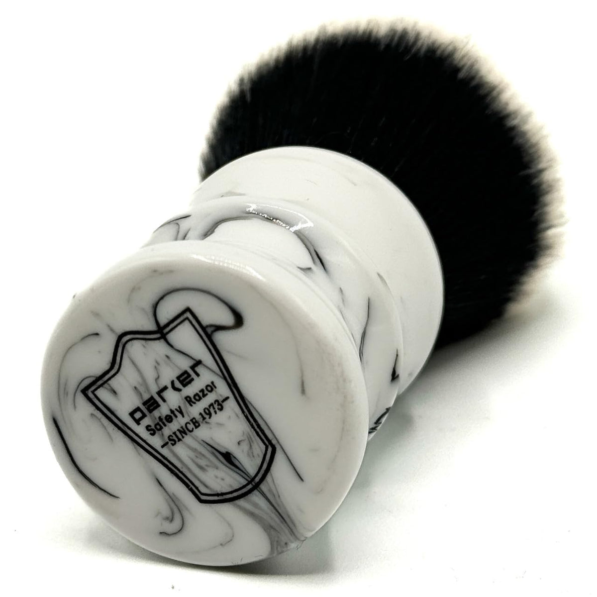 Parker Arctic Storm marble white and black handle held securely for comfortable lathering.