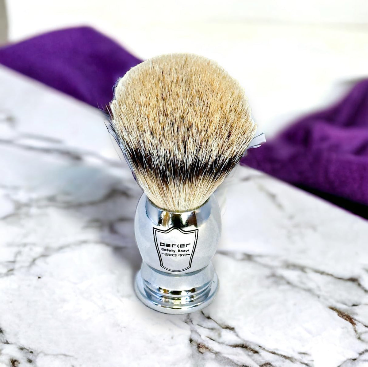 Parker SILVERTIP brush chrome handle close-up showing balanced grip.