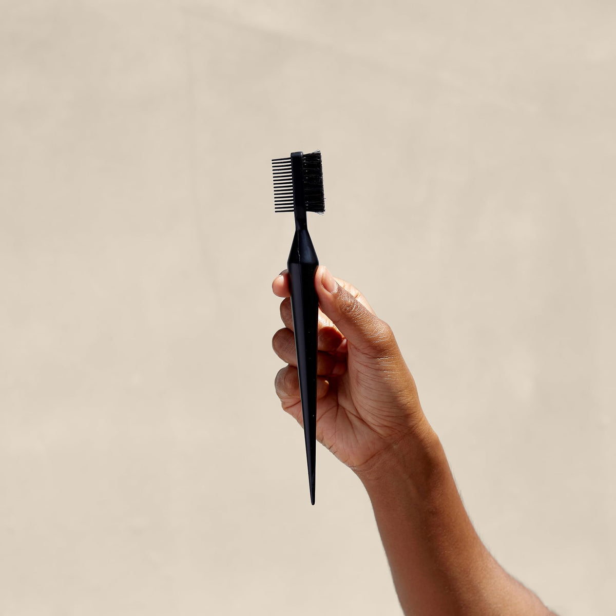 PATTERN Edge Tool parting comb aids precise sectioning during styling.
