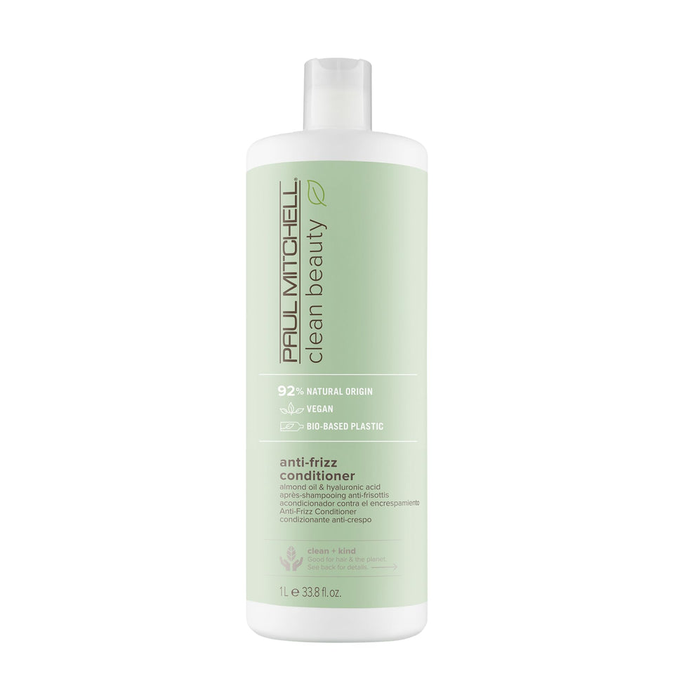 Paul Mitchell Clean Beauty Anti-Frizz Conditioner bottle pouring for smoother, frizz-free hair.