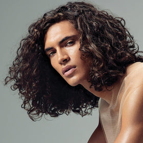 Close-up of Paul Mitchell Round Trip Defining Serum defining curls.