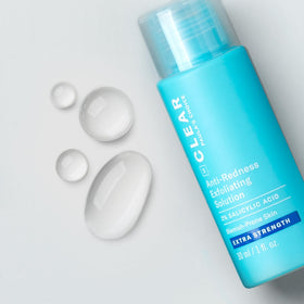 Paula's Choice CLEAR Exfoliating Solution applied on cheek for smoother skin.