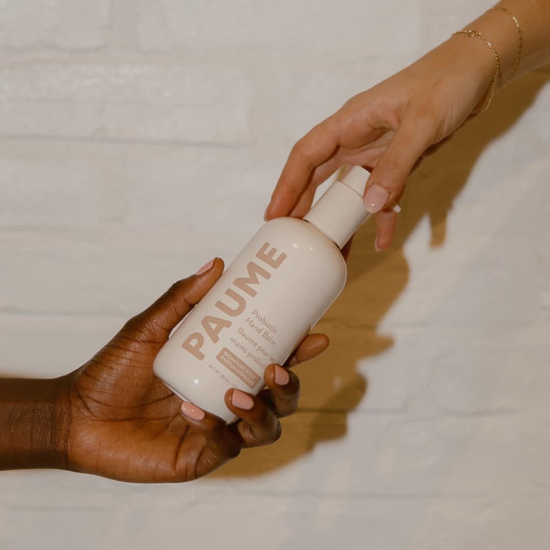 PAUME Probiotic Hand Balm used at a desk for day-long comfort.