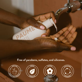 PAUME balm on dry hands delivering long-lasting hydration.