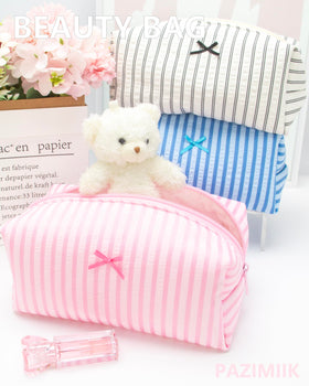 PAZIMIIK stripe pink pouch; stands upright for easy access at vanity or on the go.