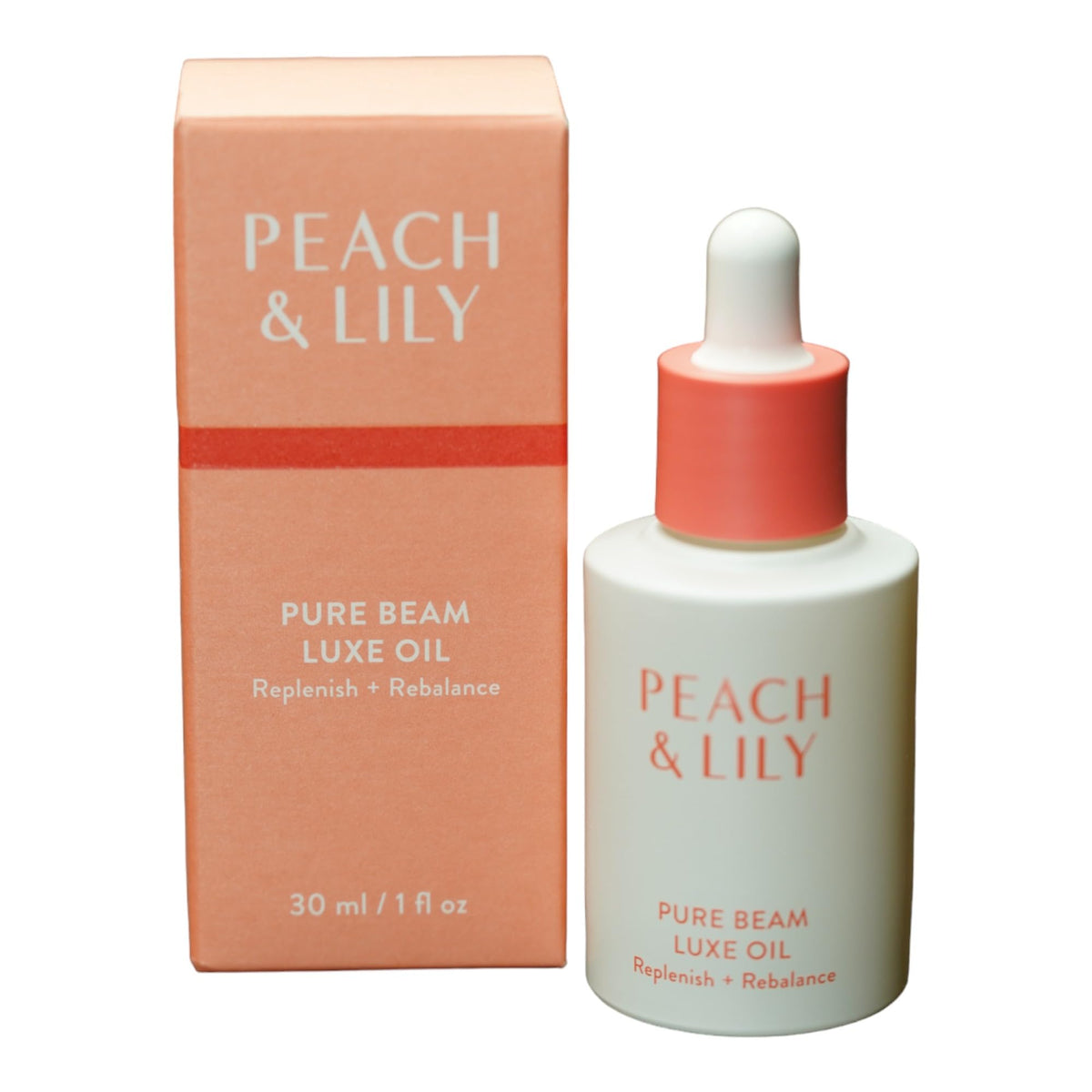 Peach & Lily Pure Beam Luxe Oil bottle close-up for daily facial hydration