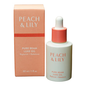 Peach & Lily Pure Beam Luxe Oil bottle close-up for daily facial hydration