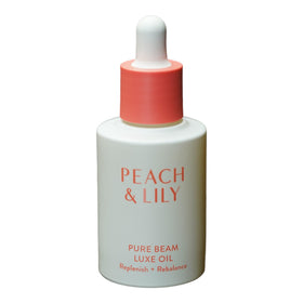 Peach & Lily Pure Beam Luxe Oil dropper on face for nourishment