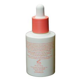 Peach & Lily Pure Beam Luxe Oil ingredients jar with sea buckthorn and jojoba