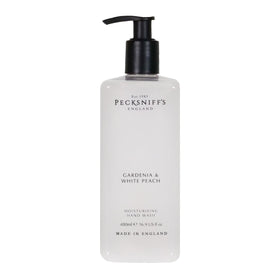 Pecksniff's Gardenia and White Peach hand wash bottle promotes soft, hydrated skin.