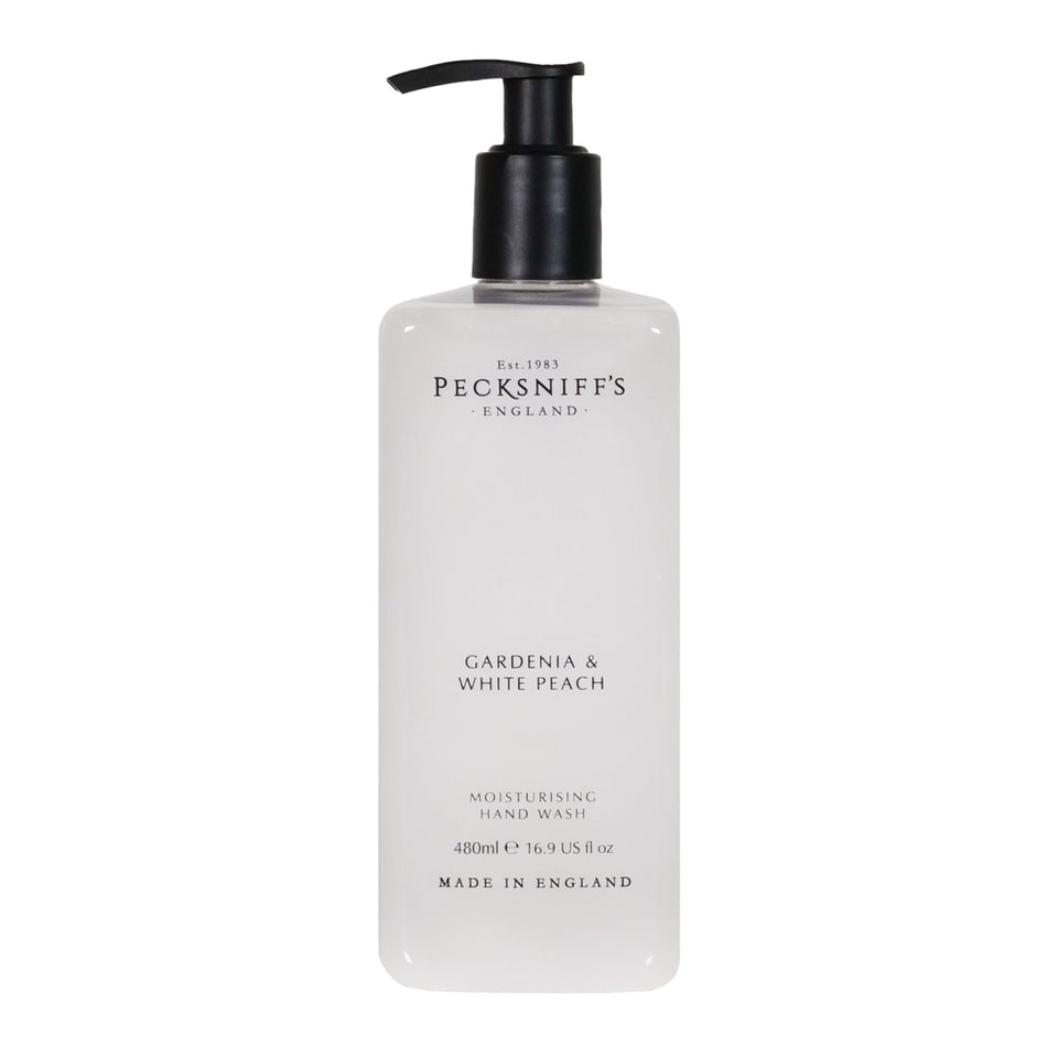 Pecksniff's Gardenia and White Peach hand wash bottle promotes soft, hydrated skin.