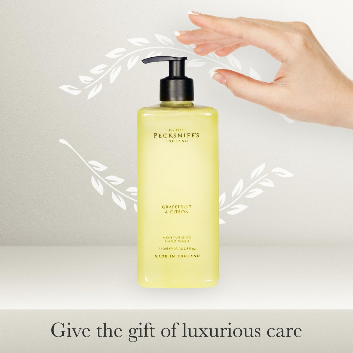 Pecksniff's Grapefruit & Citron hand wash bottle with citrus imagery suggests a luxury experience.