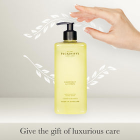 Pecksniff's Grapefruit & Citron hand wash bottle with citrus imagery suggests a luxury experience.