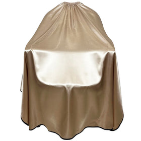 Pelocapa satin cape close-up showing waterproof fabric and soft texture for client comfort.